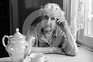 Portrait of elderly woman in her home.