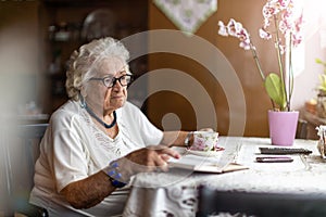 Portrait of an elderly woman at her home