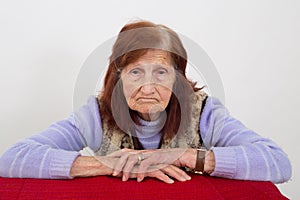 Portrait of an elderly woman with sad face expression