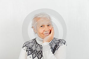 Portrait of elderly woman on white