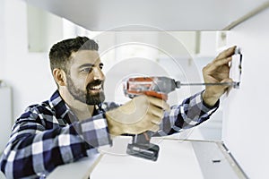 Portrait of an electrician happy worker at work