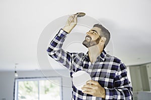 Portrait of an electrician happy worker at work