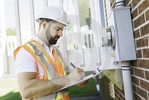 Portrait of an electrician happy worker at work