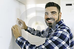 Portrait of an electrician happy worker at work