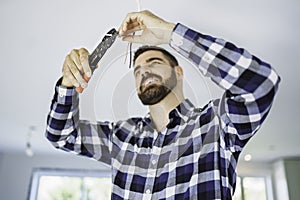 Portrait of an electrician happy worker at work