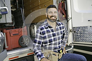 Portrait of an electrician happy worker at work