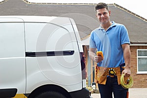 Portrait Of Electrician With Van Outside House