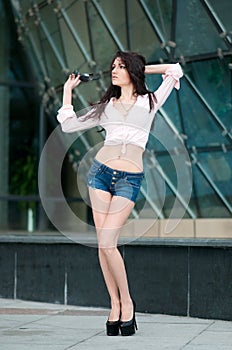 Portrait of elegance attractive woman in short jeans top