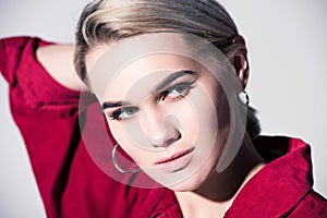 portrait of elegant fashionable girl posing in red for fashion shoot