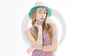 Portrait of elegant lady with hat on summer vacation, summer smiling woman in studio portrait copy space