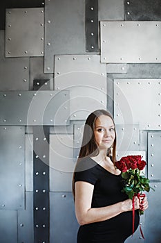 Portrait of elegant pregnant woman in black