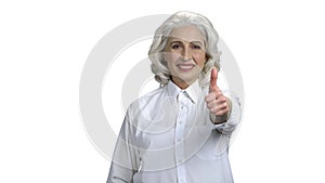 Portrait of elegant woman showing thumb up sign.