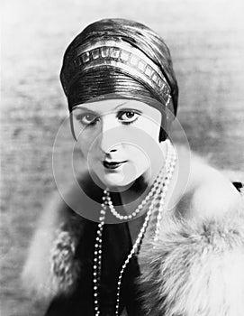 Portrait of an elegant woman in a turban and pearls