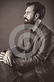 Portrait of an elegant young fashion man with beard and mustache