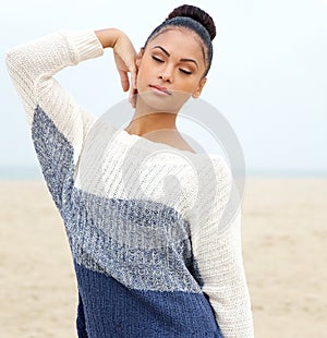 Portrait of an elegant young woman posing at the beach