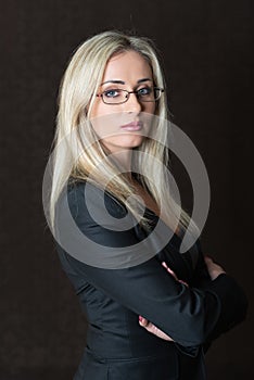 Portrait of elegantly dressed young gorgeous blond woman posing