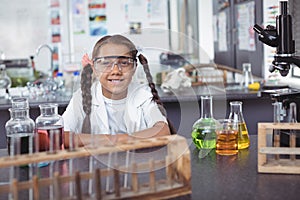 Portrait of elementary student wearing protective eyewear at laboratory