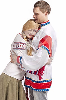 Portrait of Embraced Caucasian Couple Posing in National Costumes