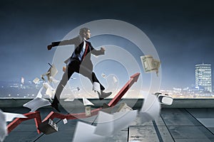 Portrait of energetic businessman running