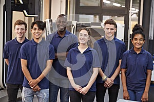 Portrait Of Engineer And Apprentices In Factory