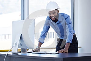 Portrait, engineer and black man in office, hard hat and computer with smile, career ambition and construction