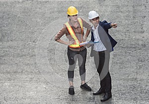 Portrait of engineer on cement background