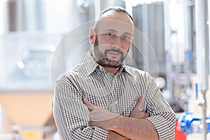 portrait engineer at control room in factory