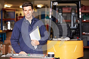 Portrait Of Engineer Standing In Factory