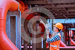 Portrait engineer under inspection and checking construction process railway and checking work on railroad station .Engineer weari