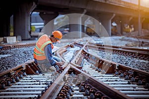 Portrait engineer under inspection and checking construction process railway switch and checking work on railroad station .Enginee