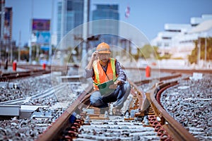 Portrait engineer under inspection and checking construction process railway switch and checking work on railroad station .Enginee