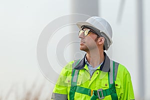 Portrait engineer wearing white hard hat safety uniform. Surveyor about renewable energy at station energy power wind. technology