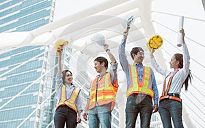 Portrait of engineering group standing near buildings. Construction Concept