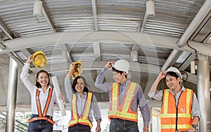 Portrait of engineering group standing near buildings. Construction Concept