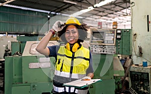 Portrait of Engineering with helmet and safety uniform standing in factory. Industrial