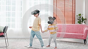 Portrait of enjoy happy kids using VR metaverse gaming technology in living room at home. Child smiling and having fun using