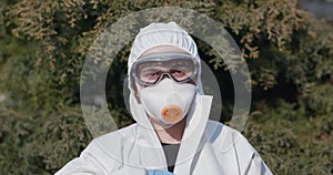 Portrait of epidemiologist protecting patients from coronavirus COVID-19 in mask. Global pandemic epidemic, Europe