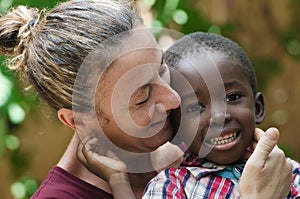Portrait of European woman with a black African boy