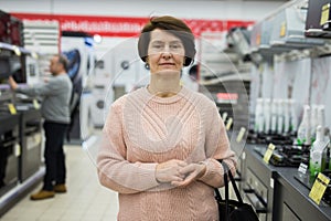 Portrait of a European woman in the gas stoves department