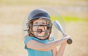 Portrait of excited amazed kid baseball player wearing helmet and hold baseball bat. Funny kids sports face.