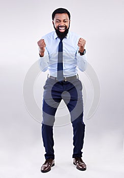 Portrait, excited and black man cheering, success and happiness against a grey studio background. Face, African American