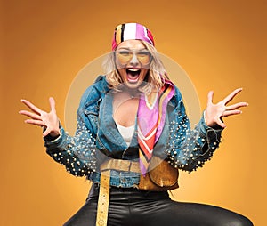 Portrait of excited blonde woman with colorful headscarf