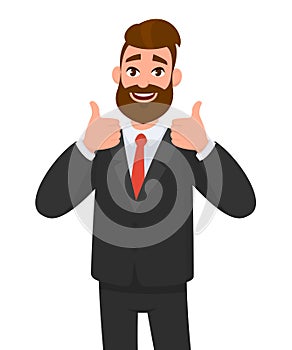 Portrait of excited business man dressed in black formal wear showing thumbs up sign. Deal, like, agree, approve, accept.