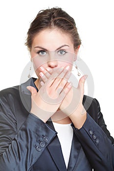 Portrait of excited business woman covering her mouth by the han