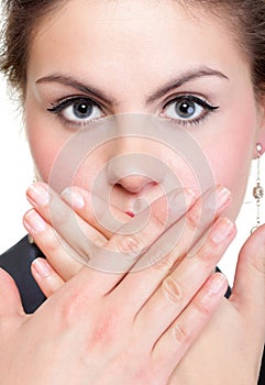 Portrait of excited business woman covering her mouth by the hand