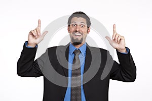 Portrait of a excited businessman pointing upwards