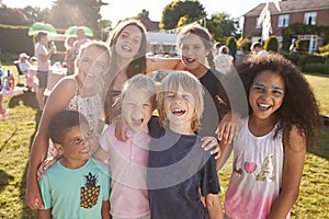 Portrait Of Excited Children At Summer Garden Fete photo