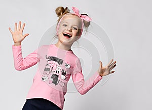 Portrait of excited funky girl screaming showing palms to camera