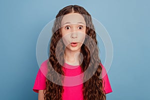 Portrait of excited funny dreamy girl open mouth look camera on blue background
