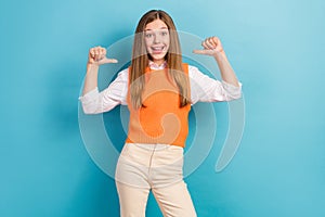 Portrait of excited positive girl toothy smile point fingers self herself isolated on blue color background